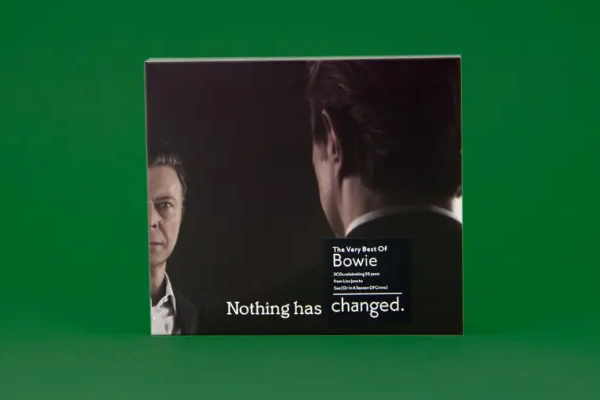 Boy and mother sitting on a bed having a serious conversation